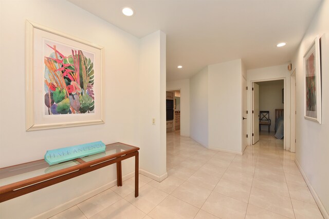 corridor with light tile patterned floors