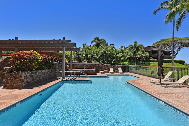 view of pool with a pergola and a patio