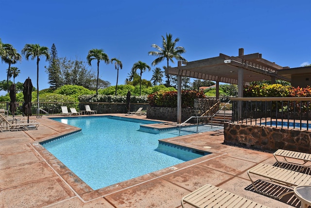 view of pool with a pergola and a patio area