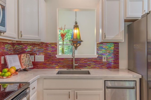 568 Hana Hwy Unit B, Paia, HI 96779 - kitchen featuring appliances with stainless steel finishes, light countertops, and backsplash