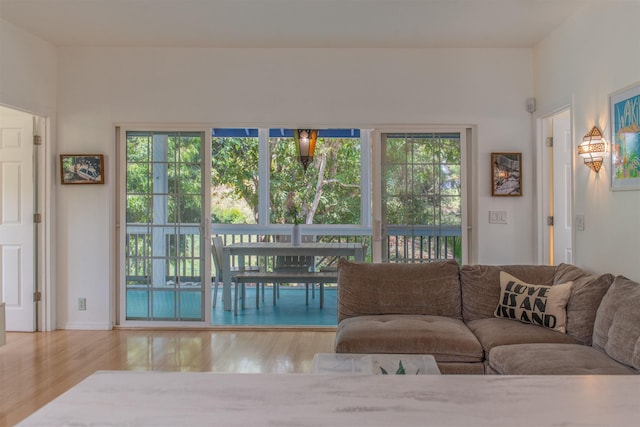 568 Hana Hwy Unit B, Paia, HI 96779 - living room with healthy amount of natural light and wood finished floors