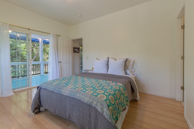 568 Hana Hwy Unit B, Paia, HI 96779 - bedroom featuring light wood-style flooring, baseboards, and access to outside
