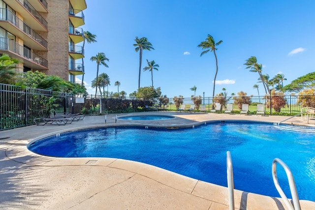 view of pool with a community hot tub