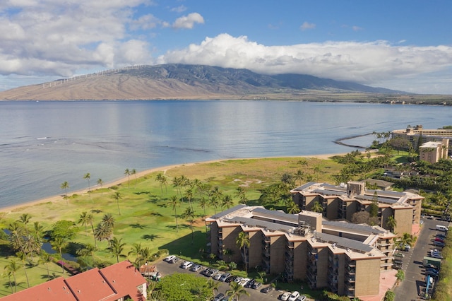 drone / aerial view with a water and mountain view