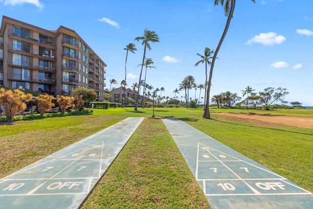 view of home's community with a lawn