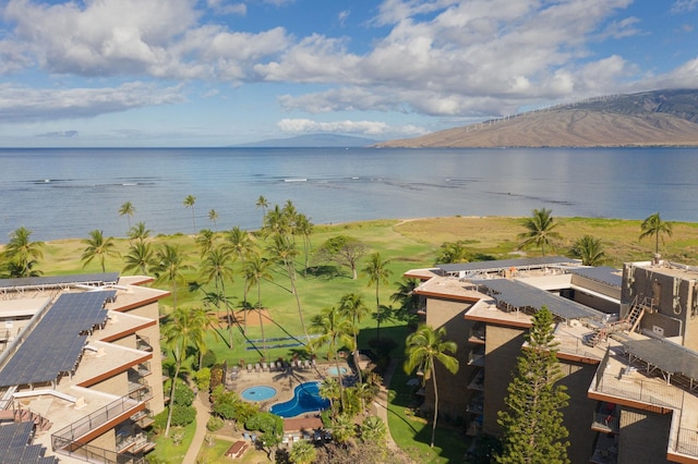 drone / aerial view featuring a water and mountain view