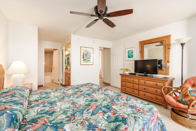 bedroom with light carpet, ceiling fan, and ensuite bath