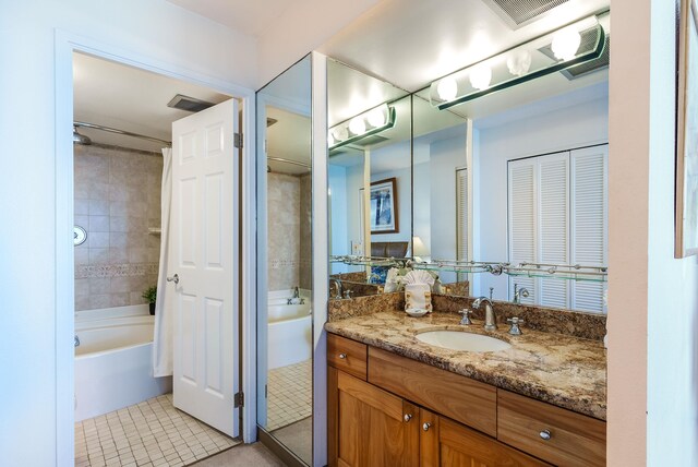 bathroom featuring vanity, shower / tub combo with curtain, and tile patterned flooring