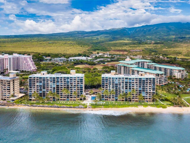 drone / aerial view with a water and mountain view