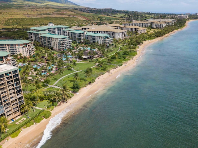 aerial view with a view of the beach, a water view, and a city view