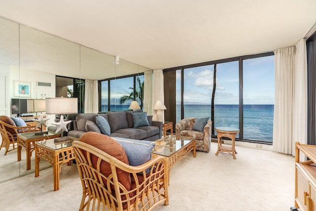 living area featuring light carpet, expansive windows, a water view, and visible vents