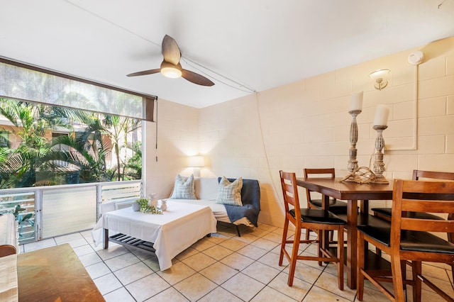 interior space featuring light tile patterned floors and ceiling fan