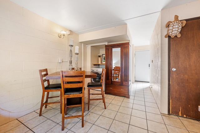 dining space with light tile patterned flooring