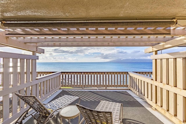 wooden deck with a water view