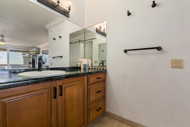 bathroom featuring tile patterned flooring, vanity, and ceiling fan