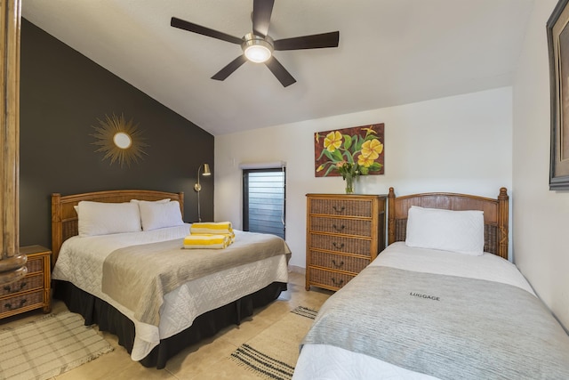 bedroom with ceiling fan, light tile patterned flooring, and lofted ceiling