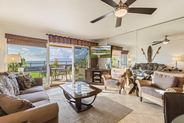 living room with ceiling fan and light tile patterned flooring