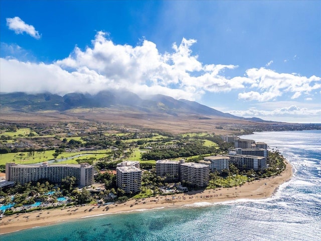 birds eye view of property featuring a beach view and a water and mountain view