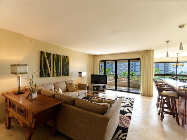 living room with light tile patterned floors and a notable chandelier