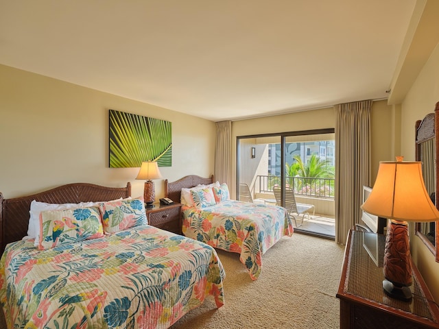 carpeted bedroom featuring access to outside