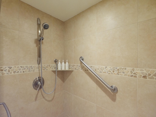 bathroom with a tile shower