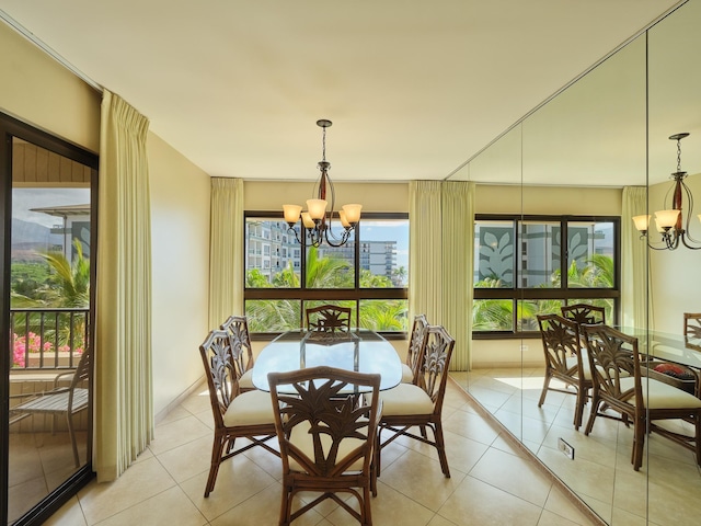 tiled dining area featuring an inviting chandelier