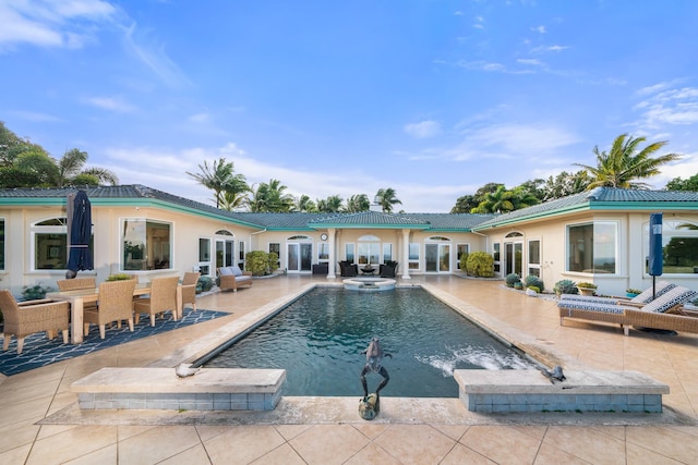 view of pool featuring a patio