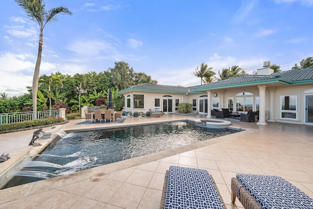 view of swimming pool featuring a patio area, an outdoor hangout area, and an in ground hot tub