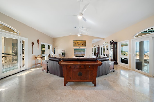 living room with ceiling fan and lofted ceiling