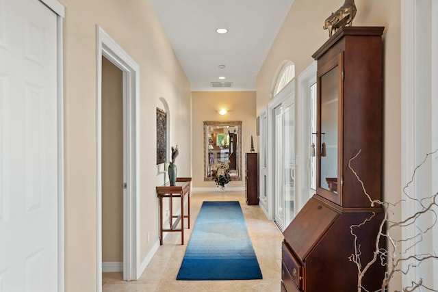 corridor featuring light tile patterned floors