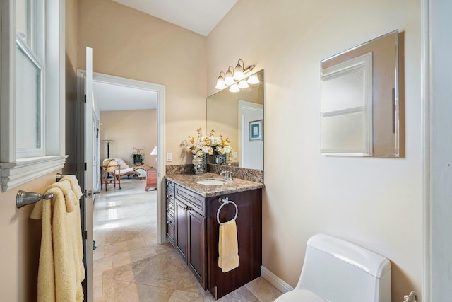 bathroom with vanity and toilet