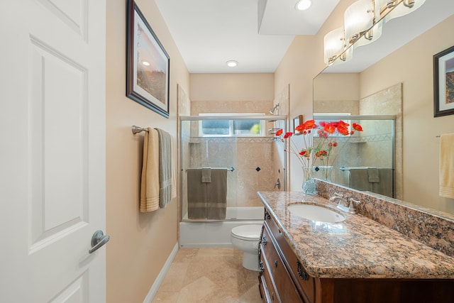 full bathroom featuring vanity, toilet, and bath / shower combo with glass door