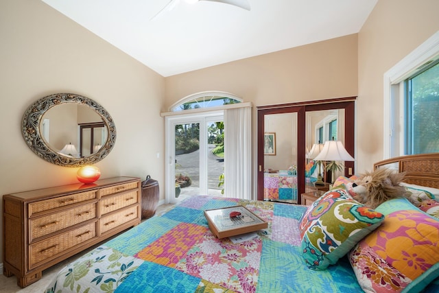 bedroom with ceiling fan, access to exterior, and lofted ceiling