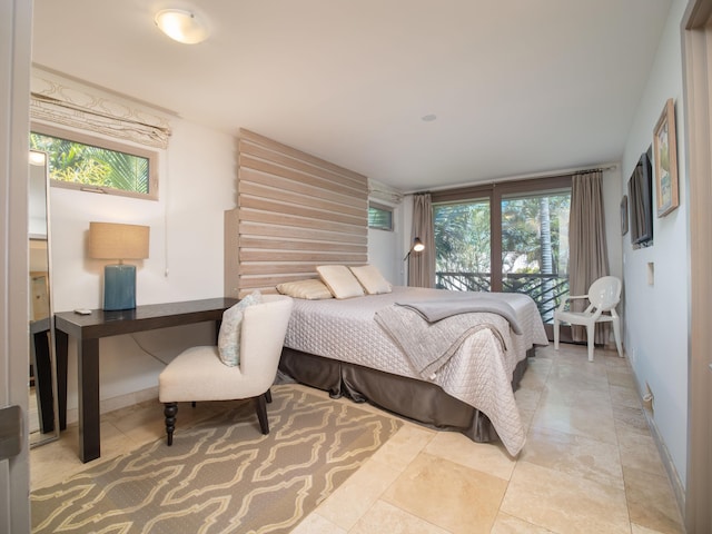 bedroom featuring light tile patterned flooring