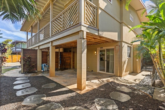 exterior space featuring a balcony and a patio