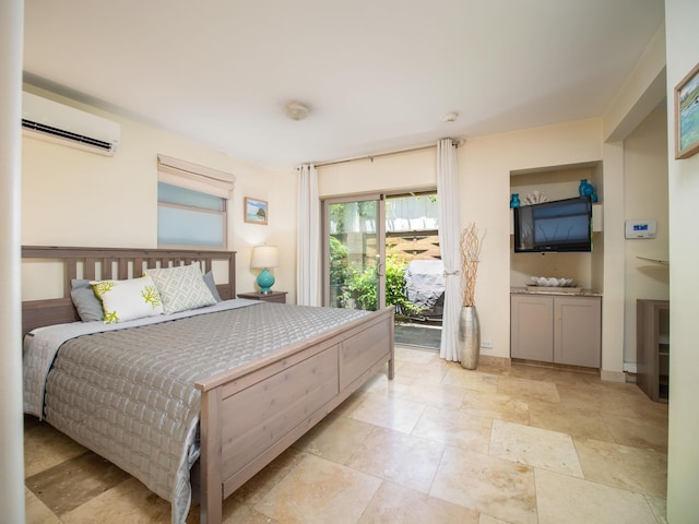 bedroom with light tile patterned flooring, a wall unit AC, and access to exterior