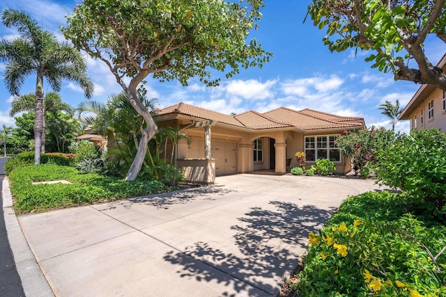 1387 Hihimanu St Unit 16, Kihei, HI 96753 - mediterranean / spanish home featuring a garage
