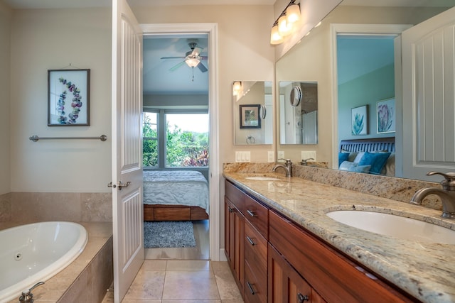 1387 Hihimanu St Unit 16, Kihei, HI 96753 - bathroom with ceiling fan, tile patterned floors, vanity, and tiled tub