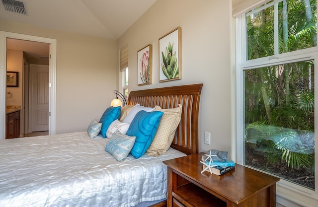 1387 Hihimanu St Unit 16, Kihei, HI 96753 - bedroom featuring lofted ceiling and ensuite bath