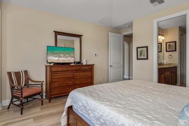 1387 Hihimanu St Unit 16, Kihei, HI 96753 - bedroom with connected bathroom and light hardwood / wood-style floors