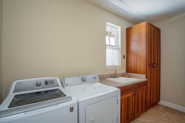 1387 Hihimanu St Unit 16, Kihei, HI 96753 - laundry area featuring sink, light tile patterned floors, cabinets, and washer and dryer