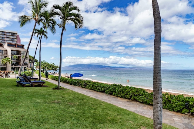 water view with a mountain view and a beach view