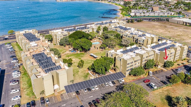 birds eye view of property with a water view