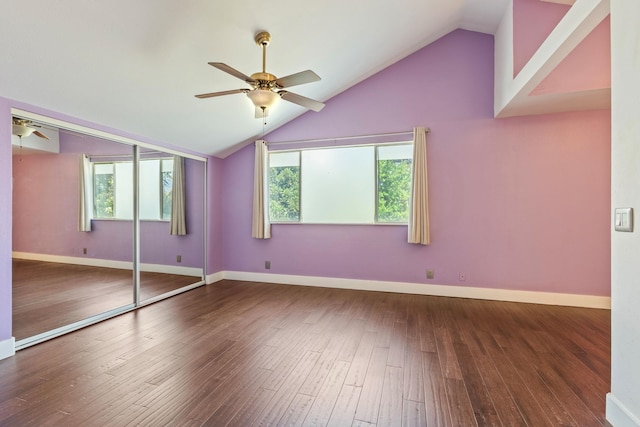 unfurnished bedroom with lofted ceiling, ceiling fan, wood finished floors, baseboards, and a closet