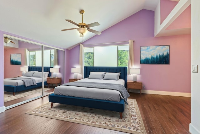 bedroom with a closet, wood finished floors, a ceiling fan, and baseboards