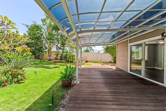 wooden deck with a yard, fence, and a pergola