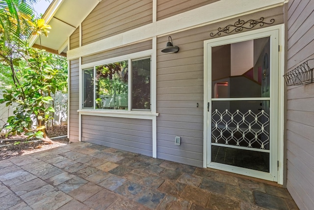 doorway to property featuring a patio