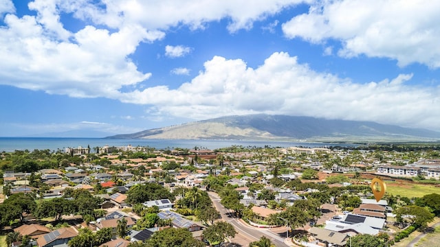 bird's eye view with a residential view and a water and mountain view