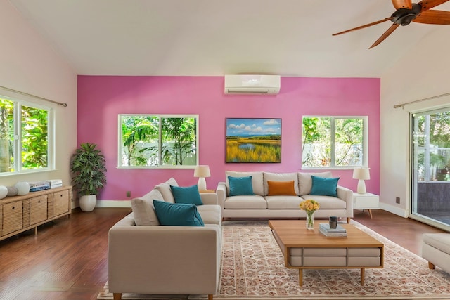 living room with lofted ceiling, baseboards, wood finished floors, and a wall mounted air conditioner