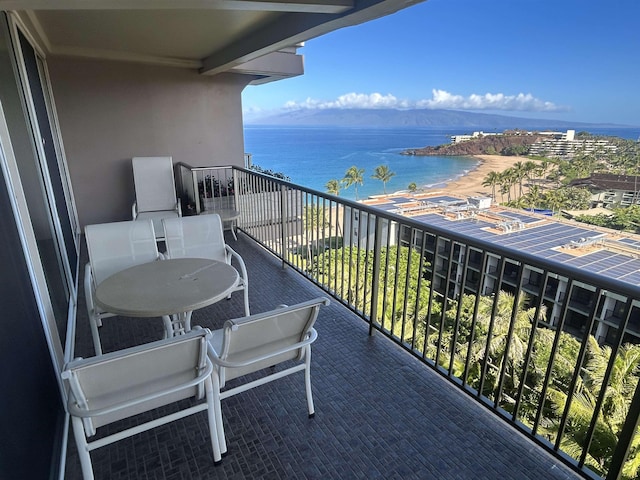 balcony featuring a water view